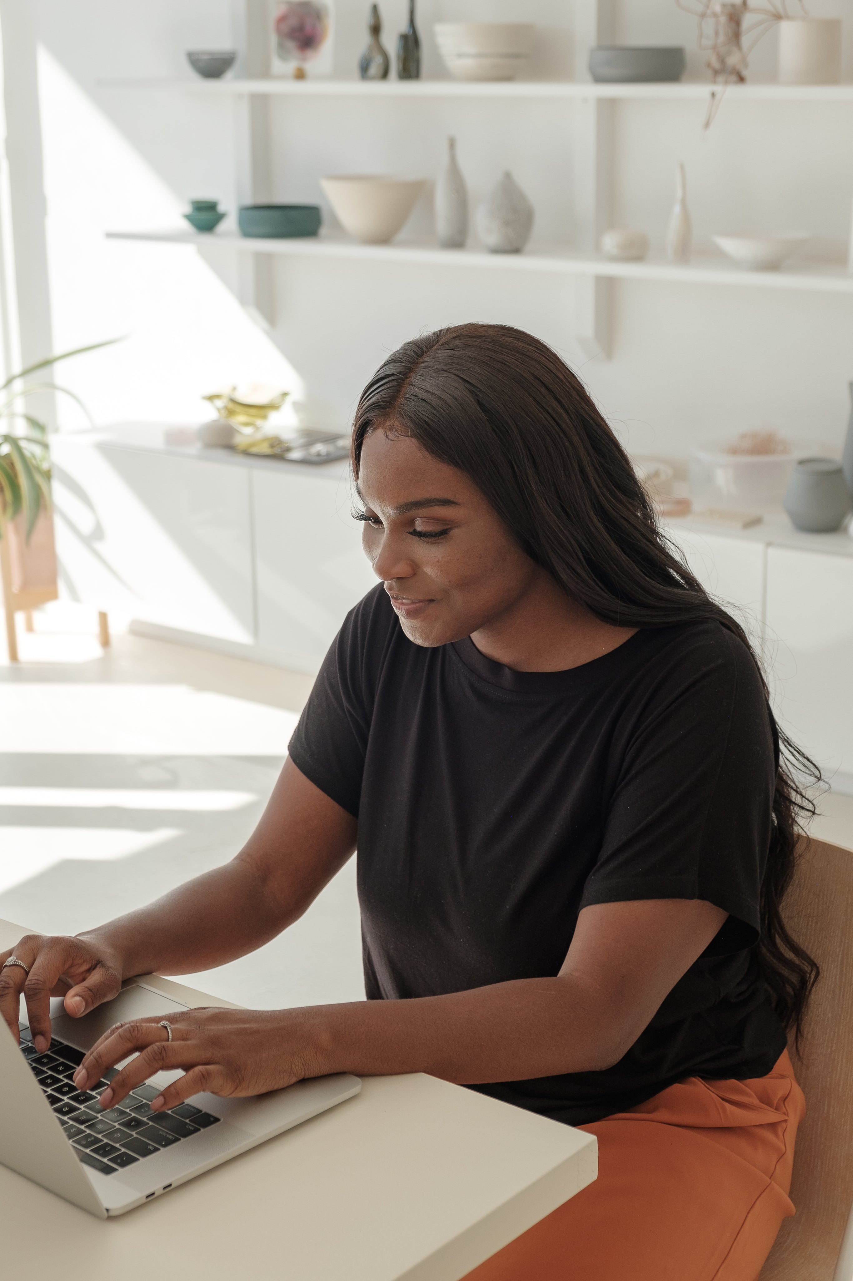 files/young-woman-smiles-as-she-checks-on-her-online-store.jpg